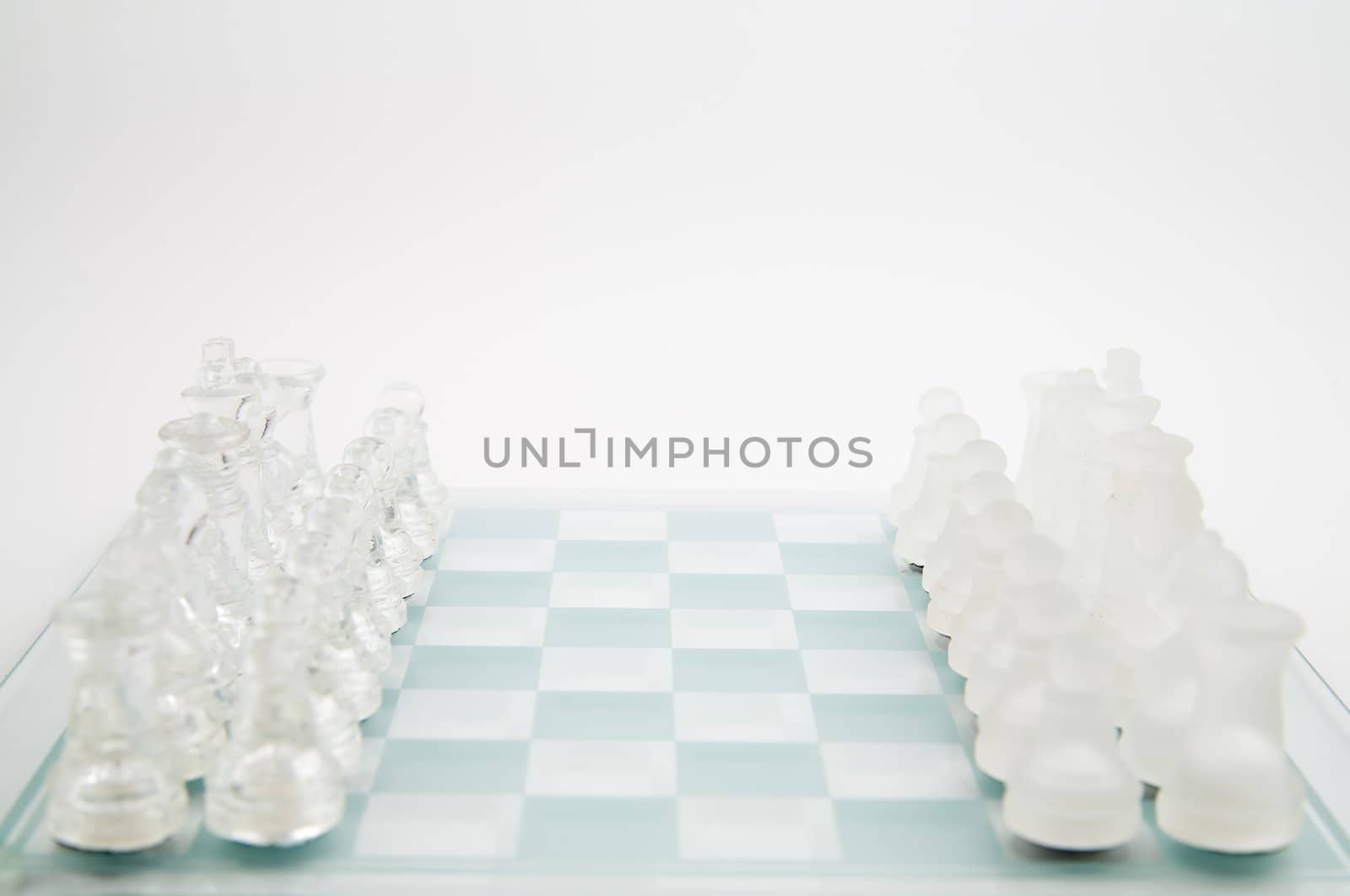 glass chess on the transparent chessboard