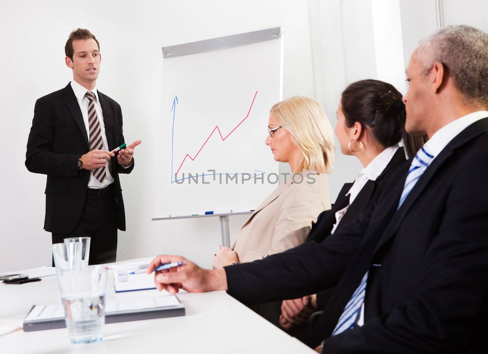 Businessman giving a presentation by AndreyPopov