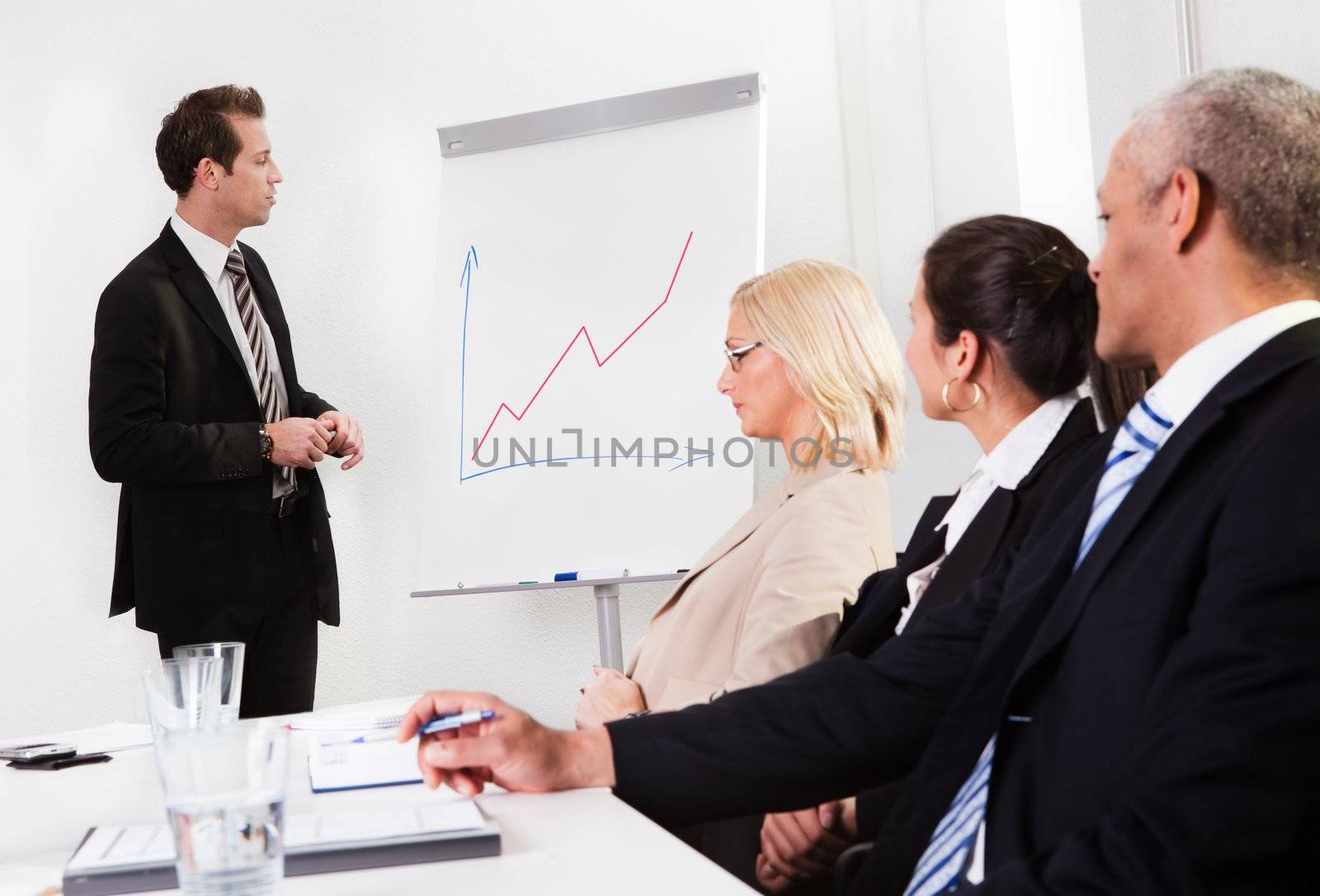 Businessman giving a presentation by AndreyPopov