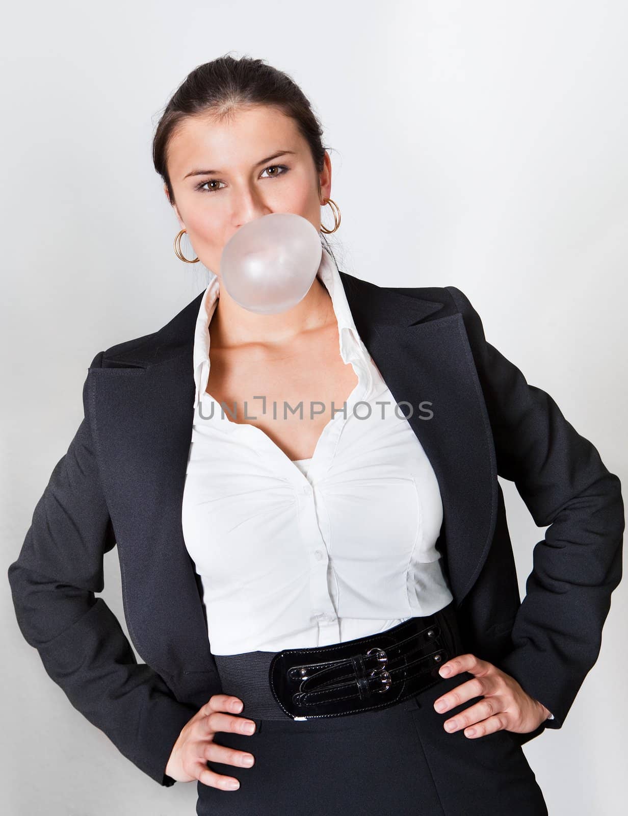 Businesswoman blowing bubblegum by AndreyPopov
