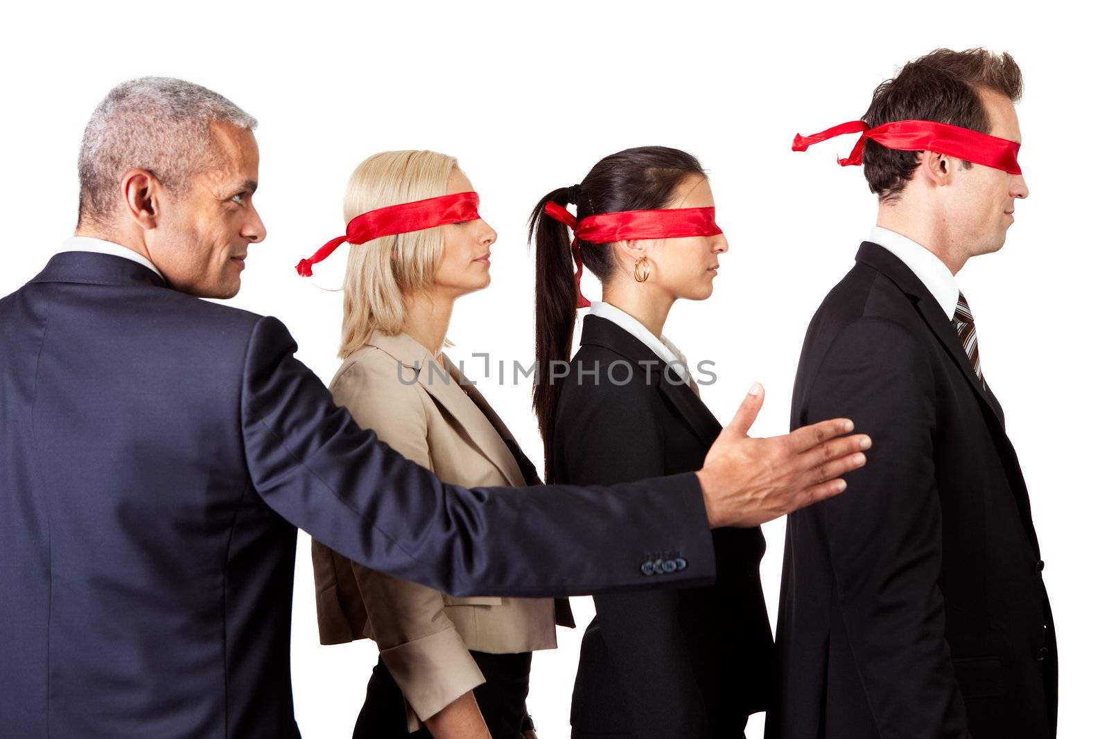 Businessman showing the way for group of disoriented businesspeople