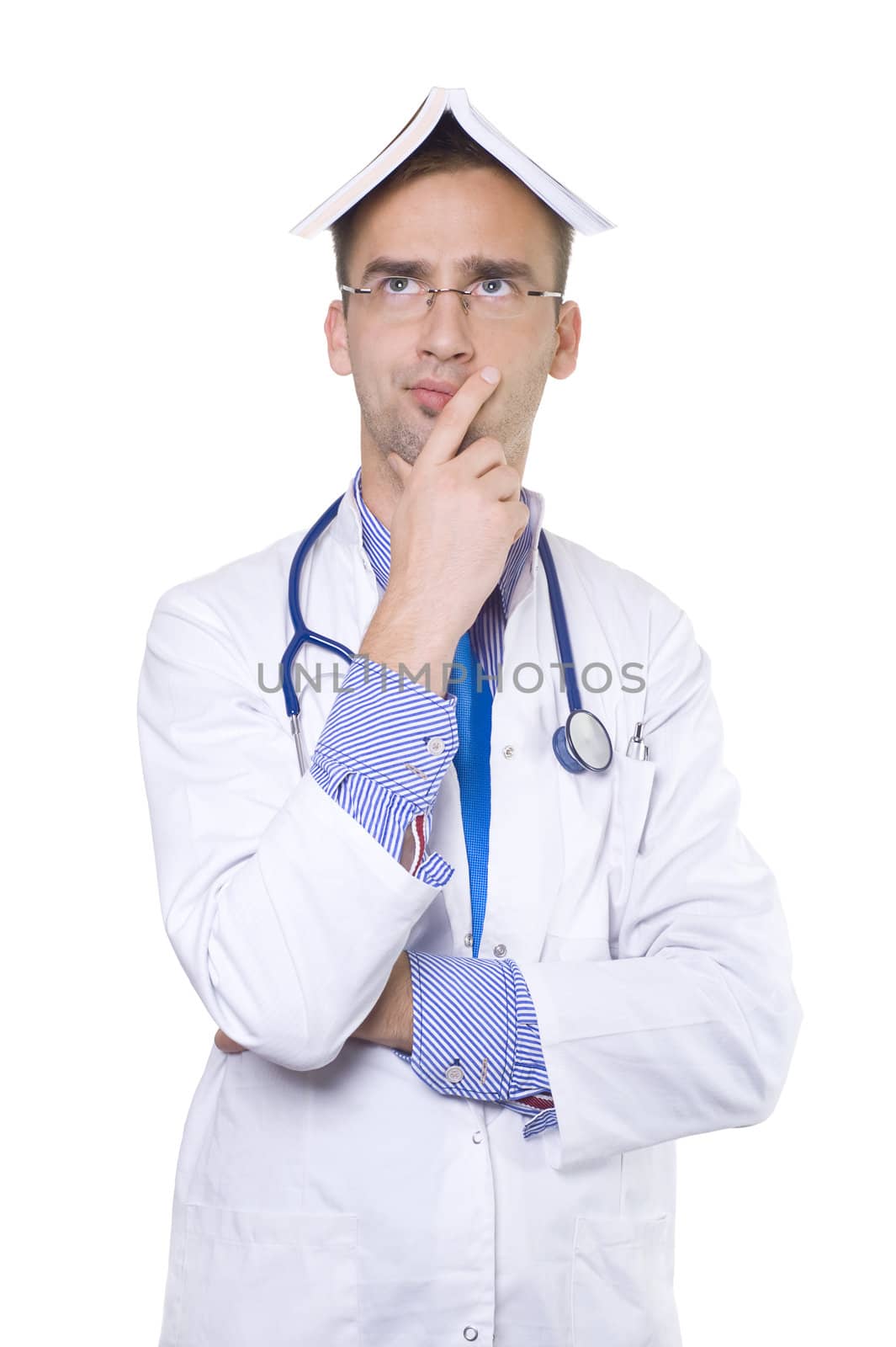 concerned male doctor with book on his head