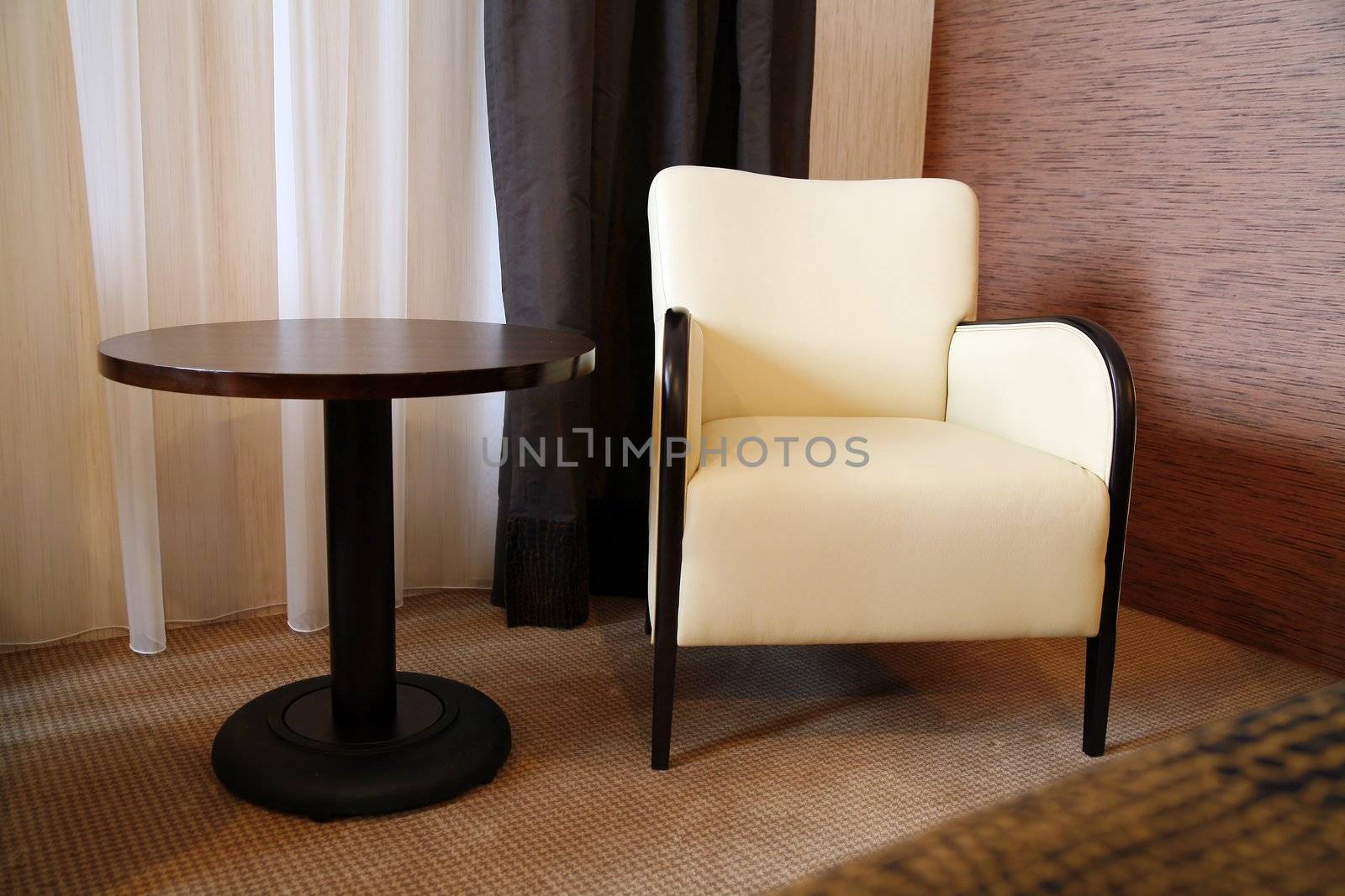 brown table and comfortable chair