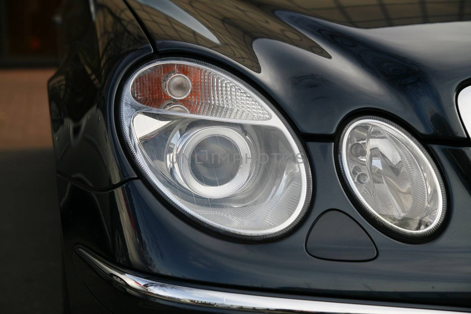 headlamp of expensive car by furzyk73