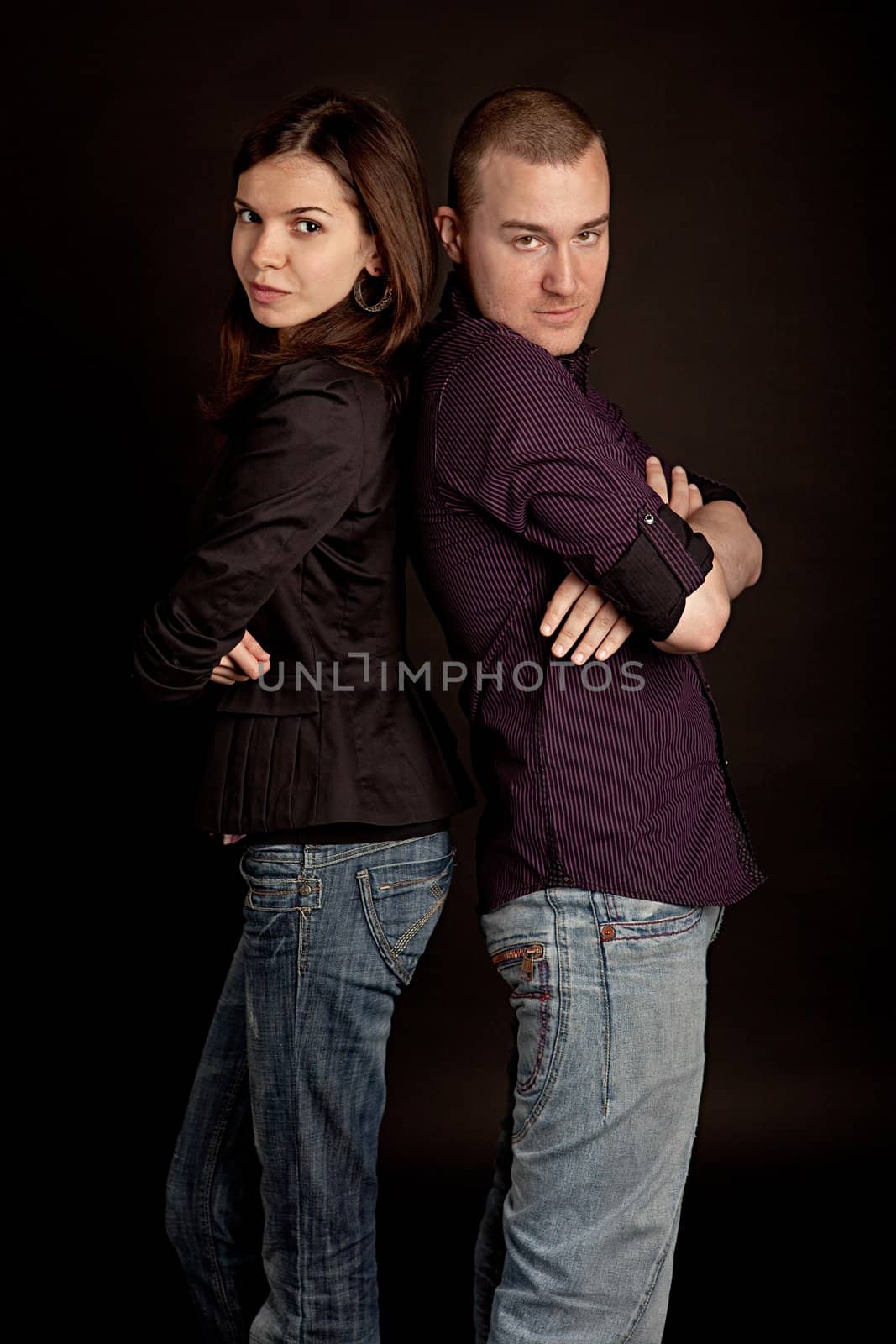 Beautiful young couple posing. Shot in studio