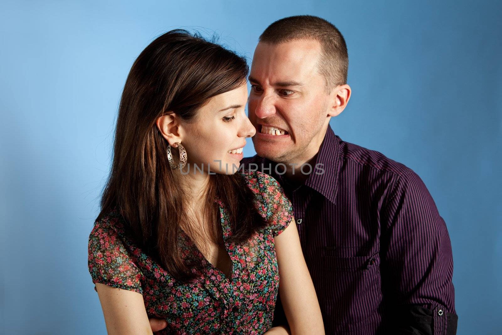 Women and her angry boyfriend. Studio shot