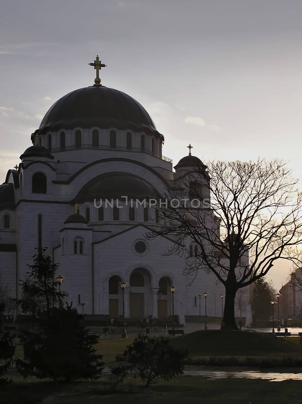 Main entrance to orthodox church in Belgrade Serbia, temple of Sveti Sava, at late evening sunset.