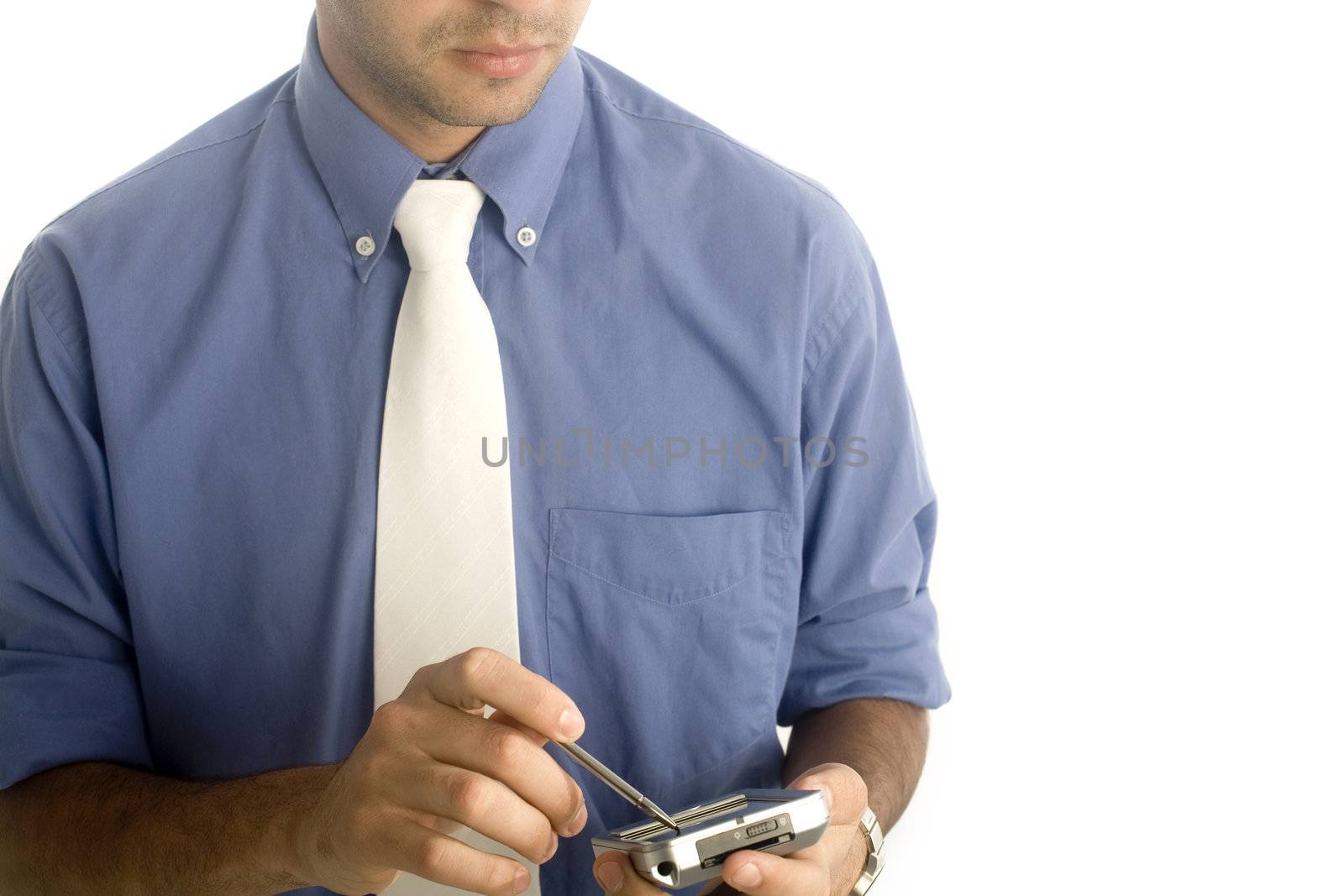 A 20 year old latino business man, isolated on a white background using a PDA.