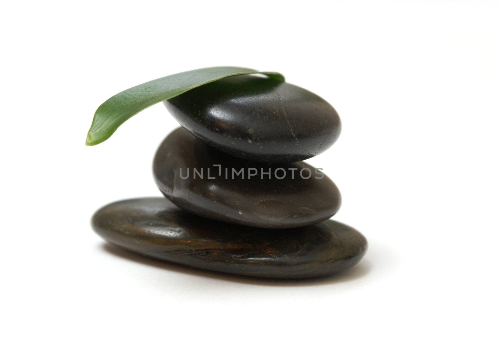 A few stones balanced and isolated on a white background.