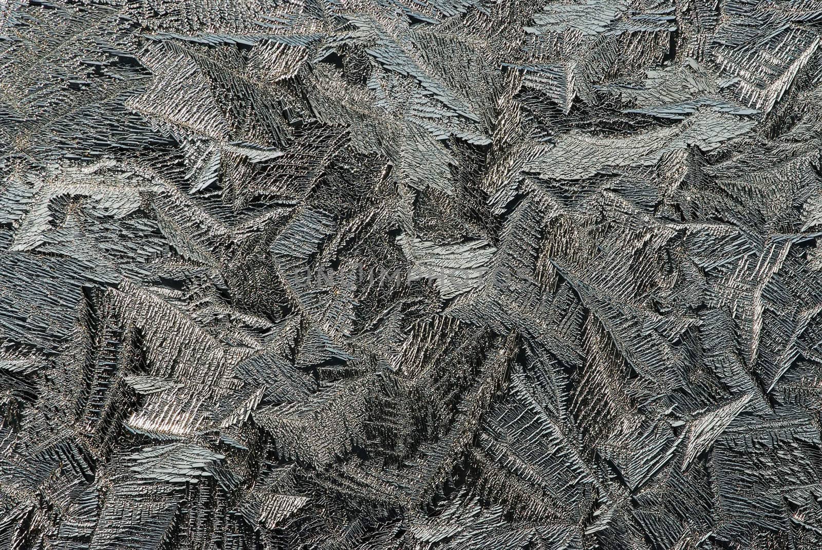 Hoarfrost on glass, texture of ice in thee cold winter.