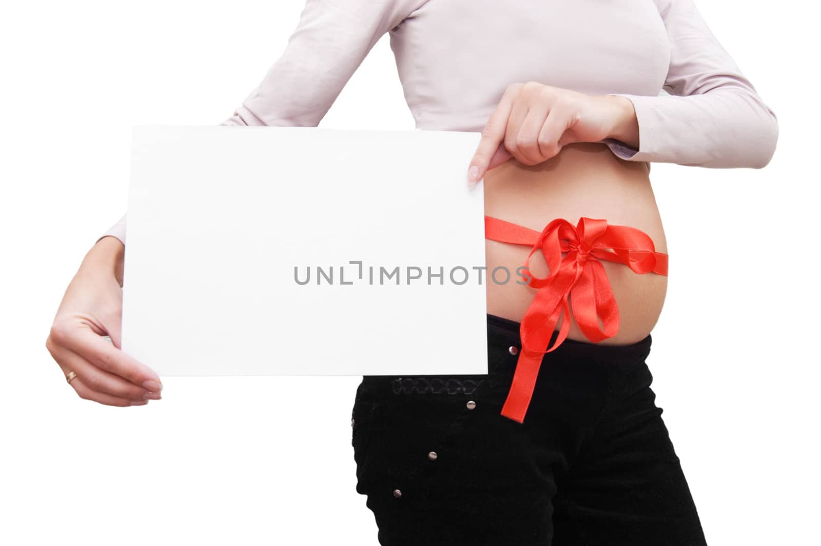 Woman' s belly with blank board and red ribbon over white