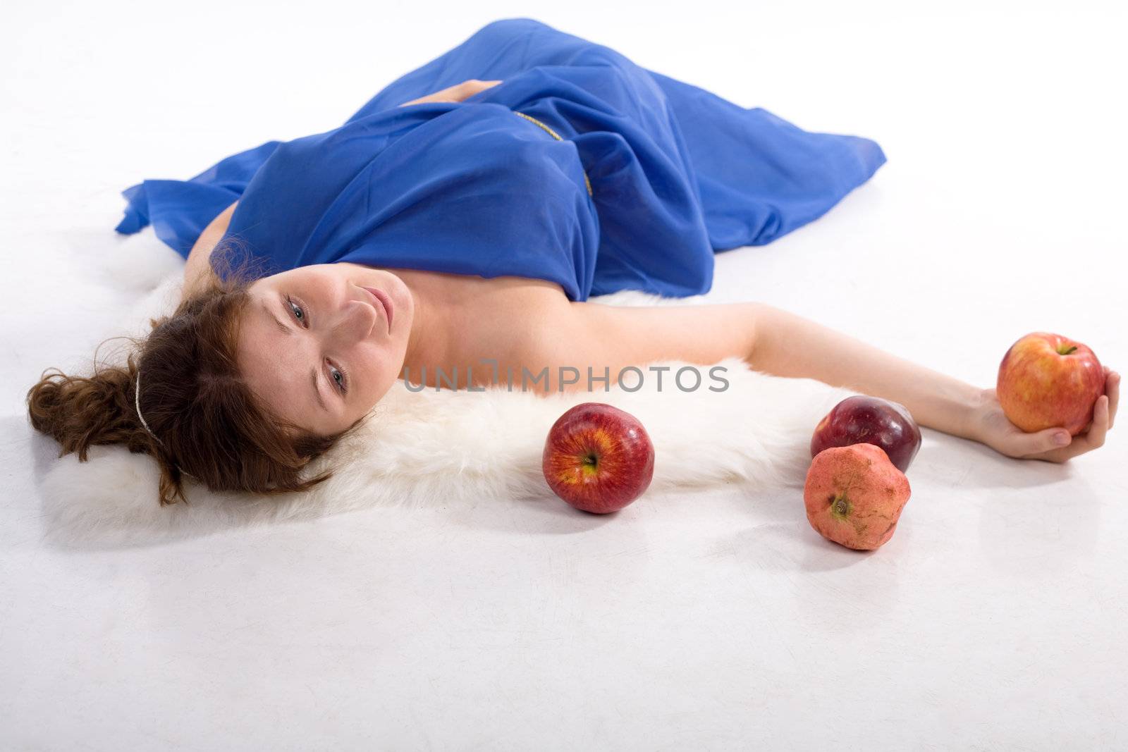 Lady in blue antique dress and red apples on white background
