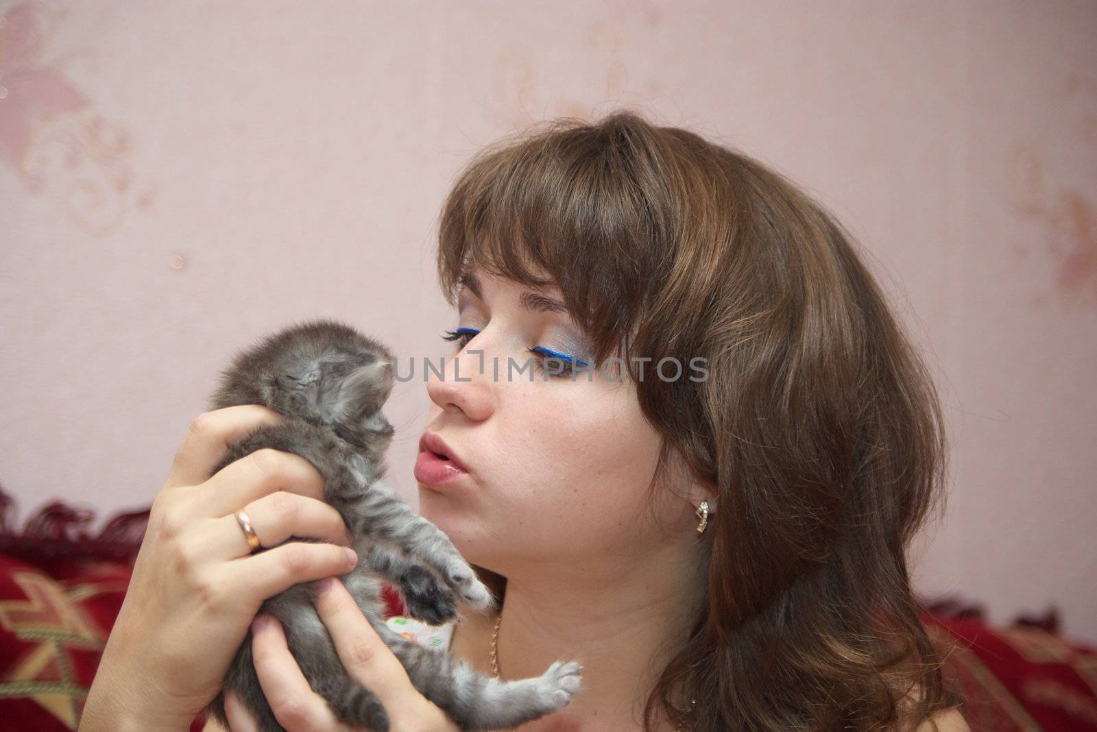 photo of the beautiful woman playing with kitty