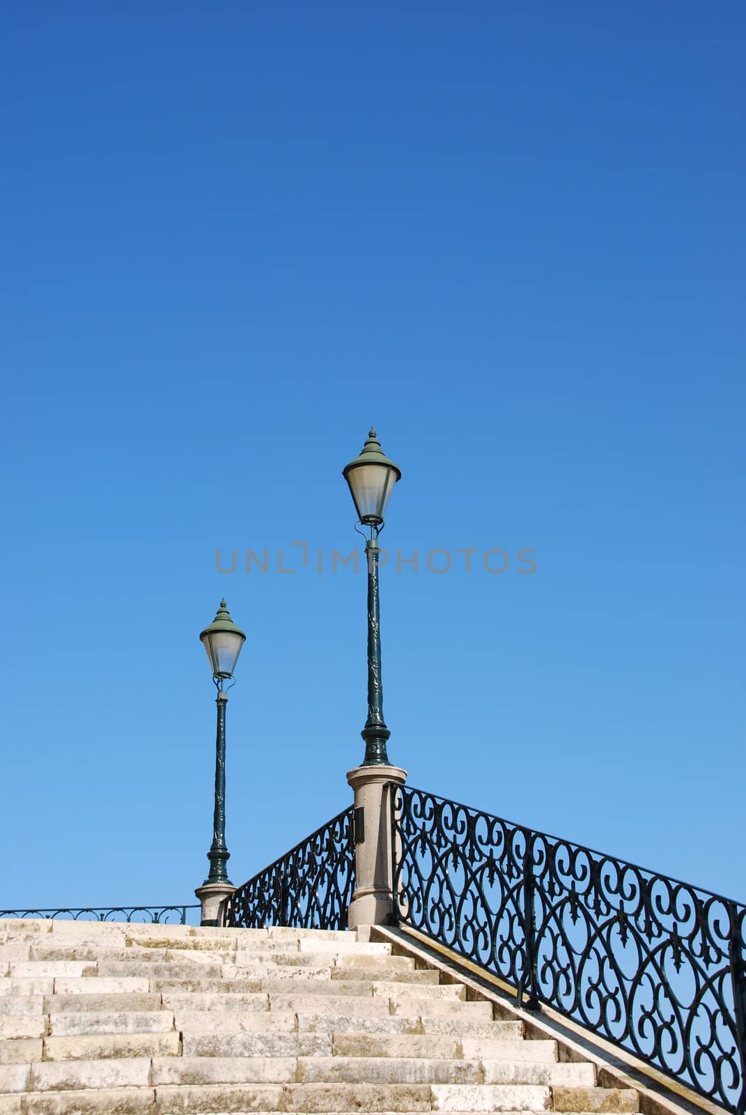 Vintage stairway with traditional lamp post (blue sky) by luissantos84