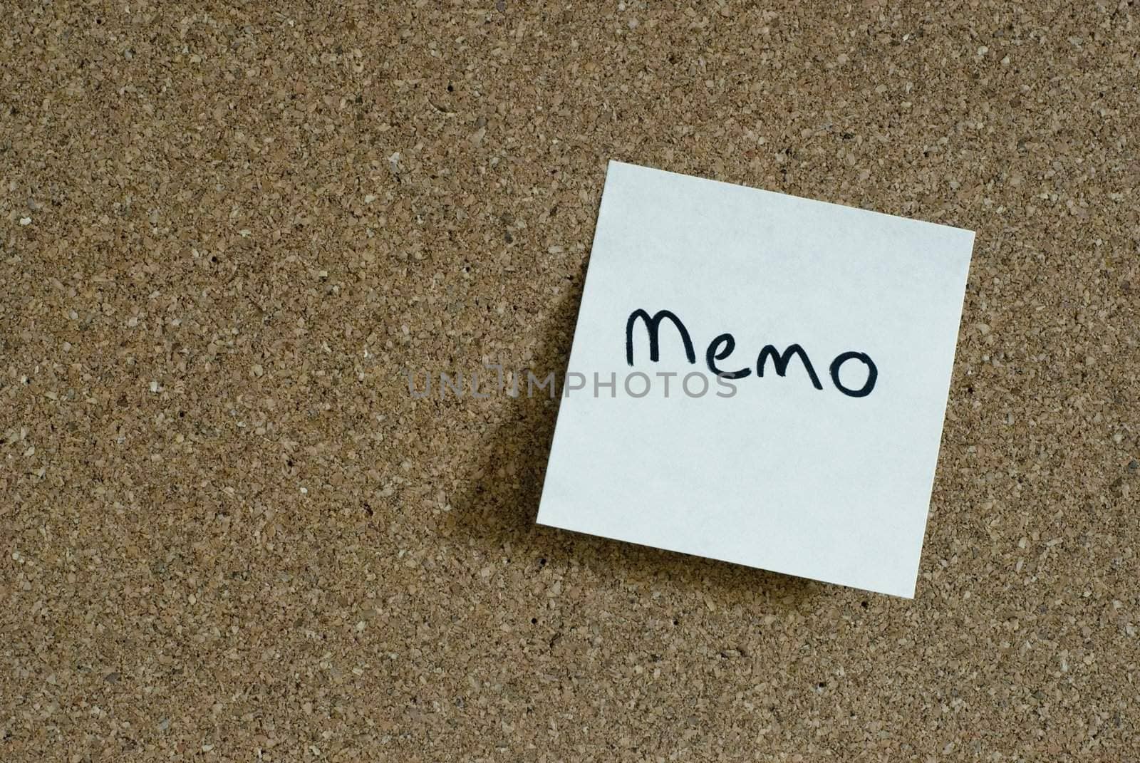 yellow "post it" note on a corkboard background