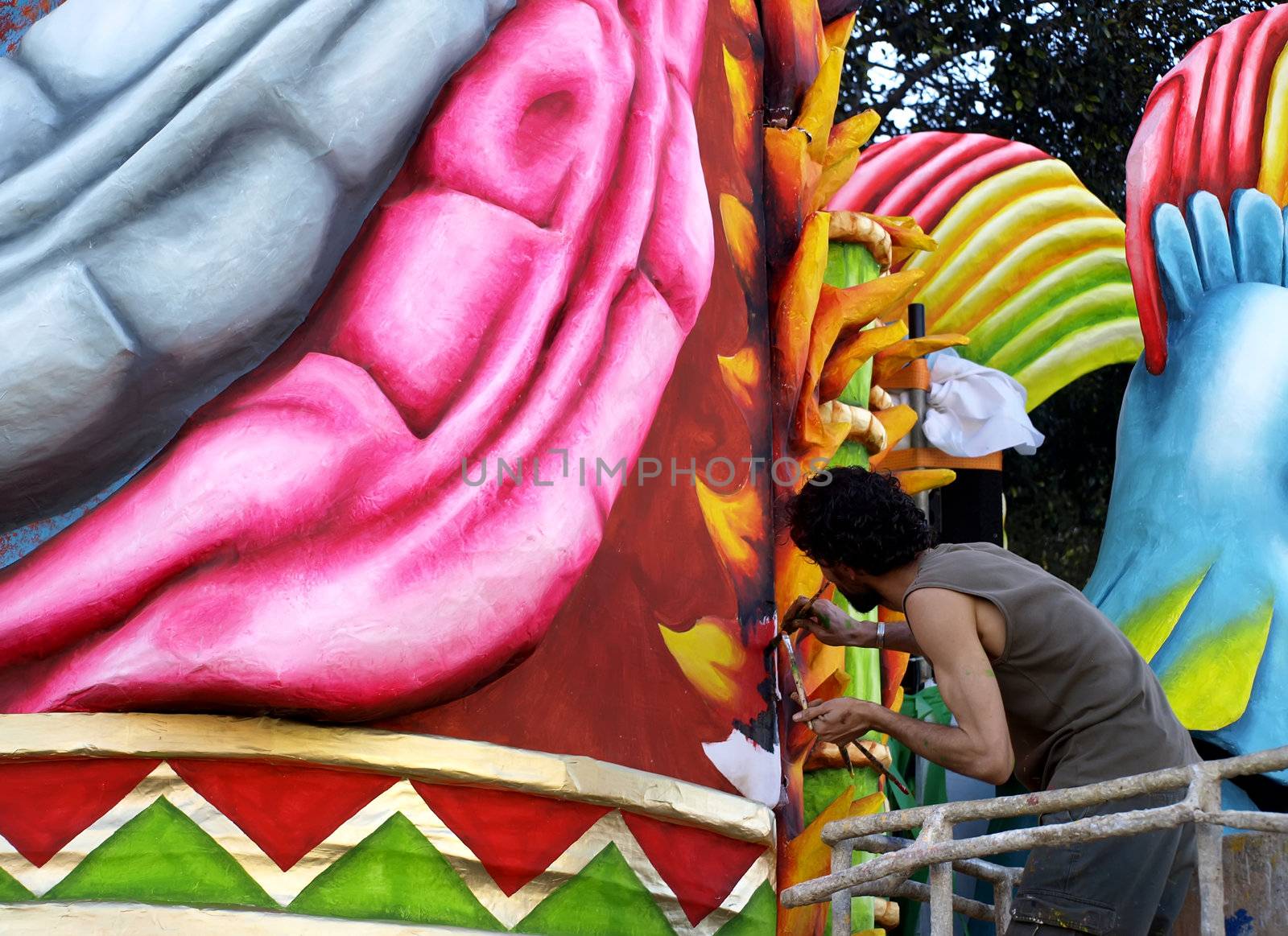 Artist applying final touches to float from the International Carnival of Malta 2008  