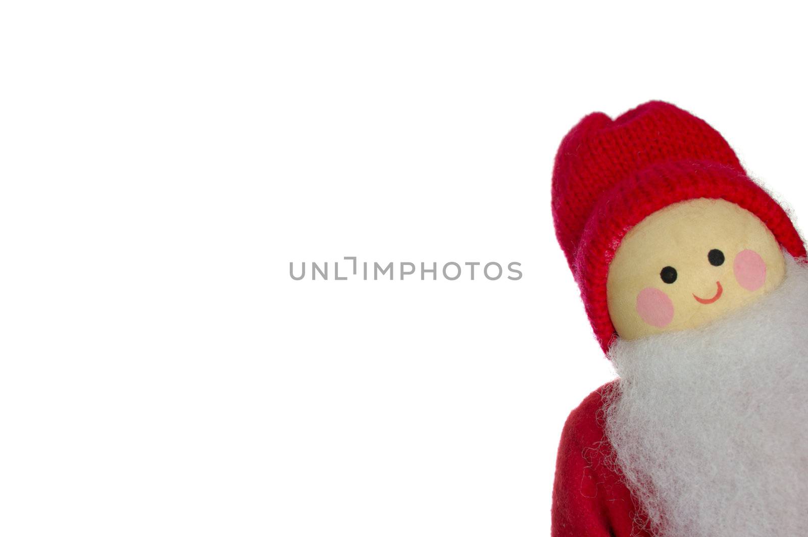 A wooden Father Christmas doll, peeping into the frame, isolated on a white background. Space for text.