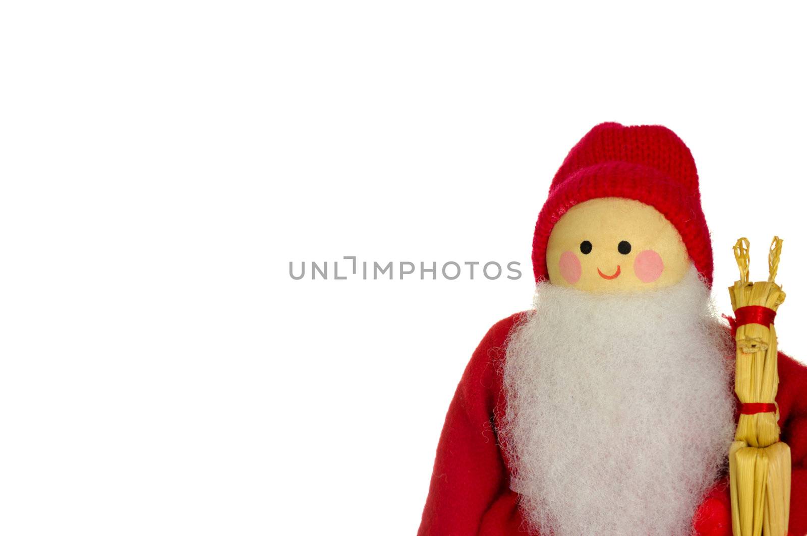 A wooden Father Christmas doll, holding a straw reindeer, isolated on a white background. Space for text.