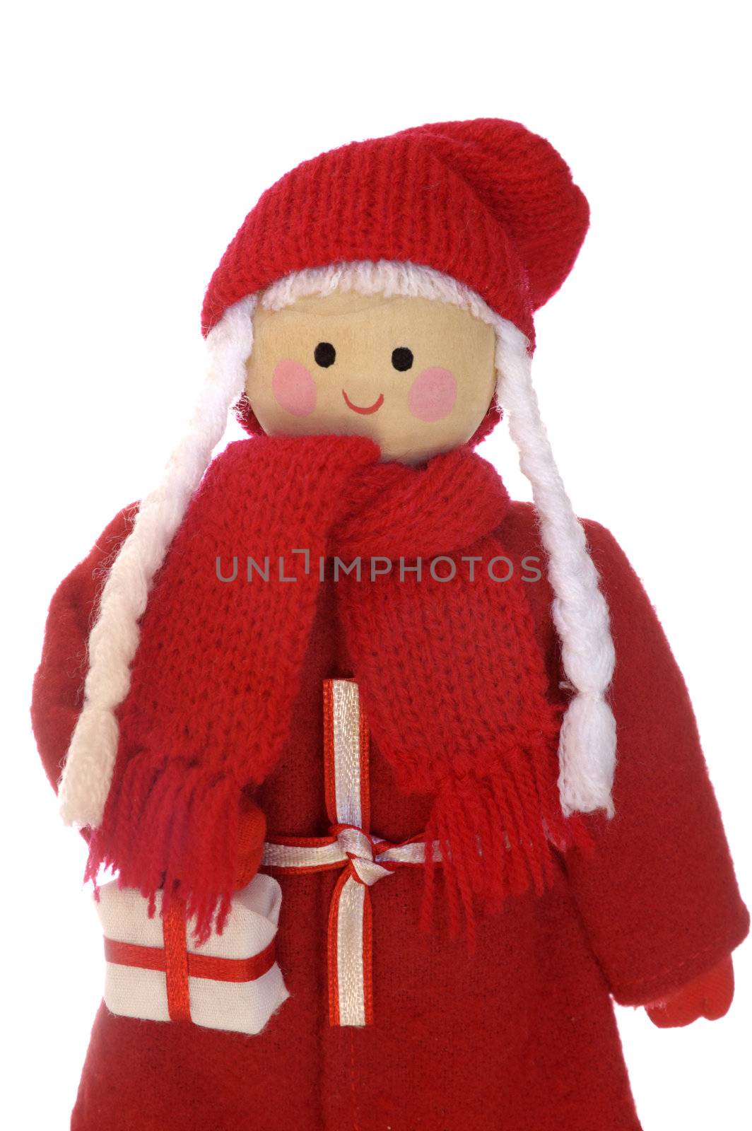 A wooden Mother Christmas doll, holding a present, isolated on a white background. Space for text.