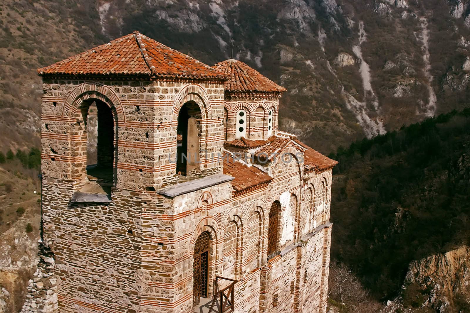 Old antique ortodox church in mountains with trees