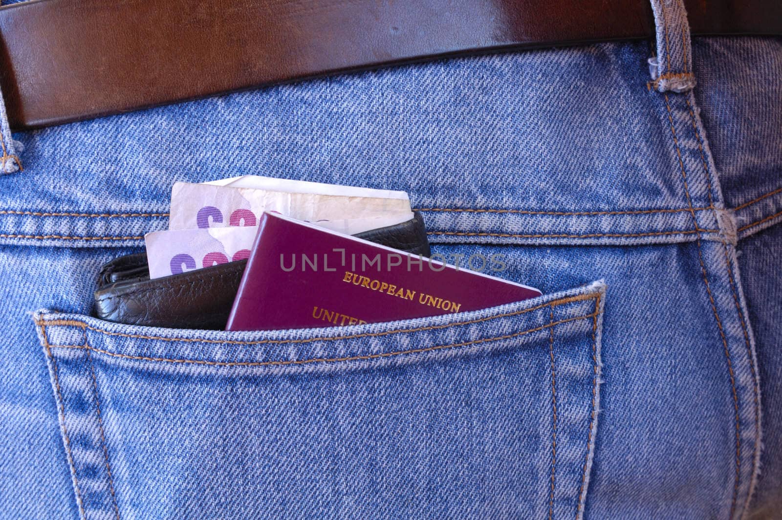 A passport, and a wallet, containing several �20 notes, poke out of the rear pocket of someone's jeans. A temptation for a pickpocket.