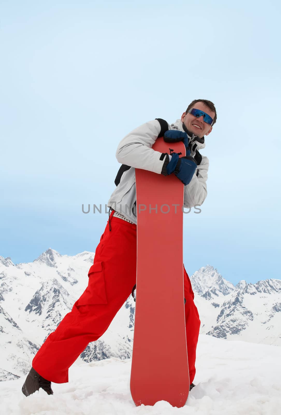 Man with red snowboard by alex_garaev