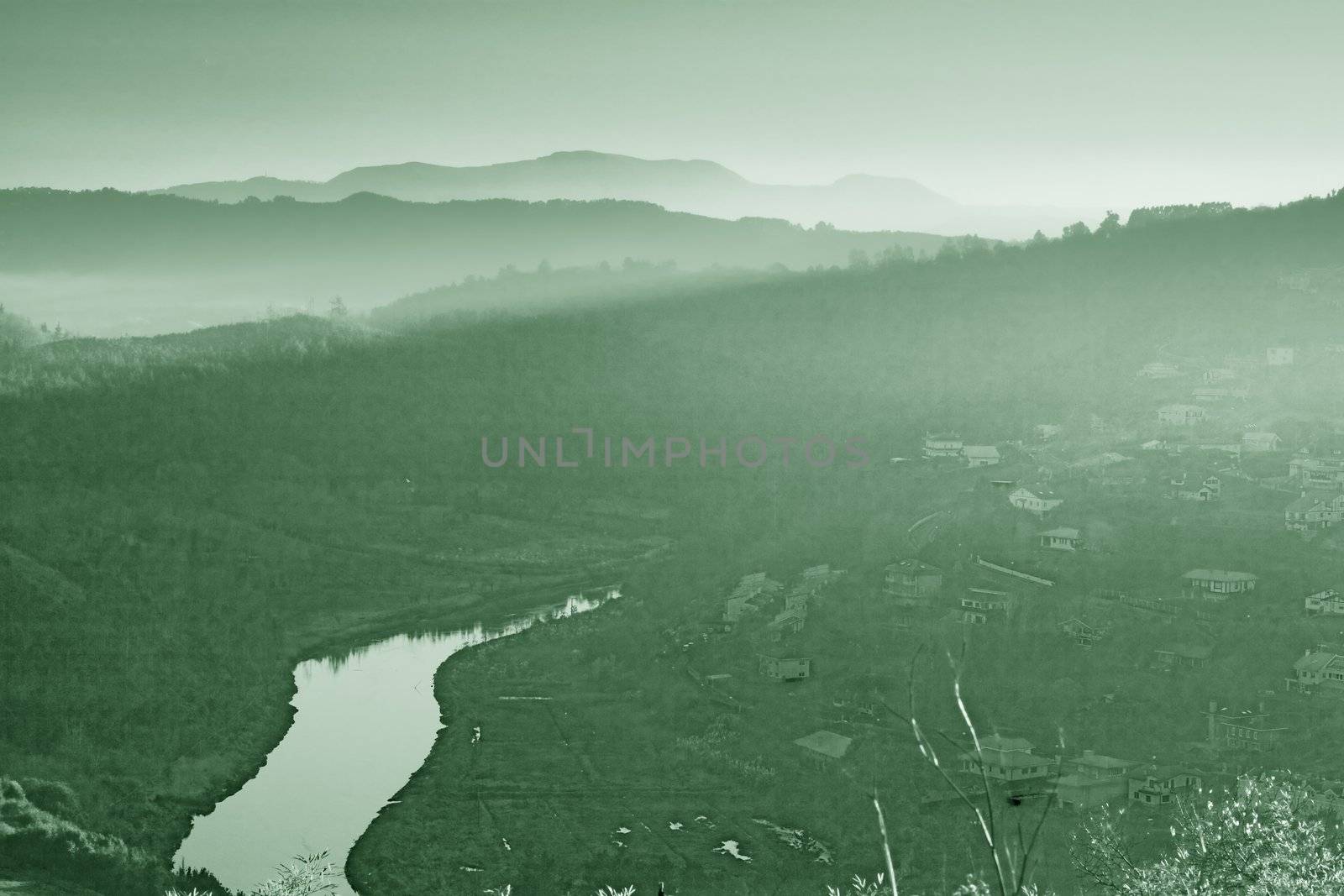 monochromatic image of some mountains and a river