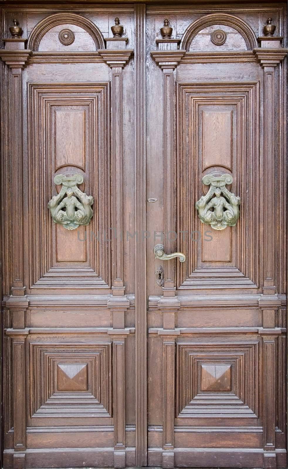 an old door knocker on ancient door