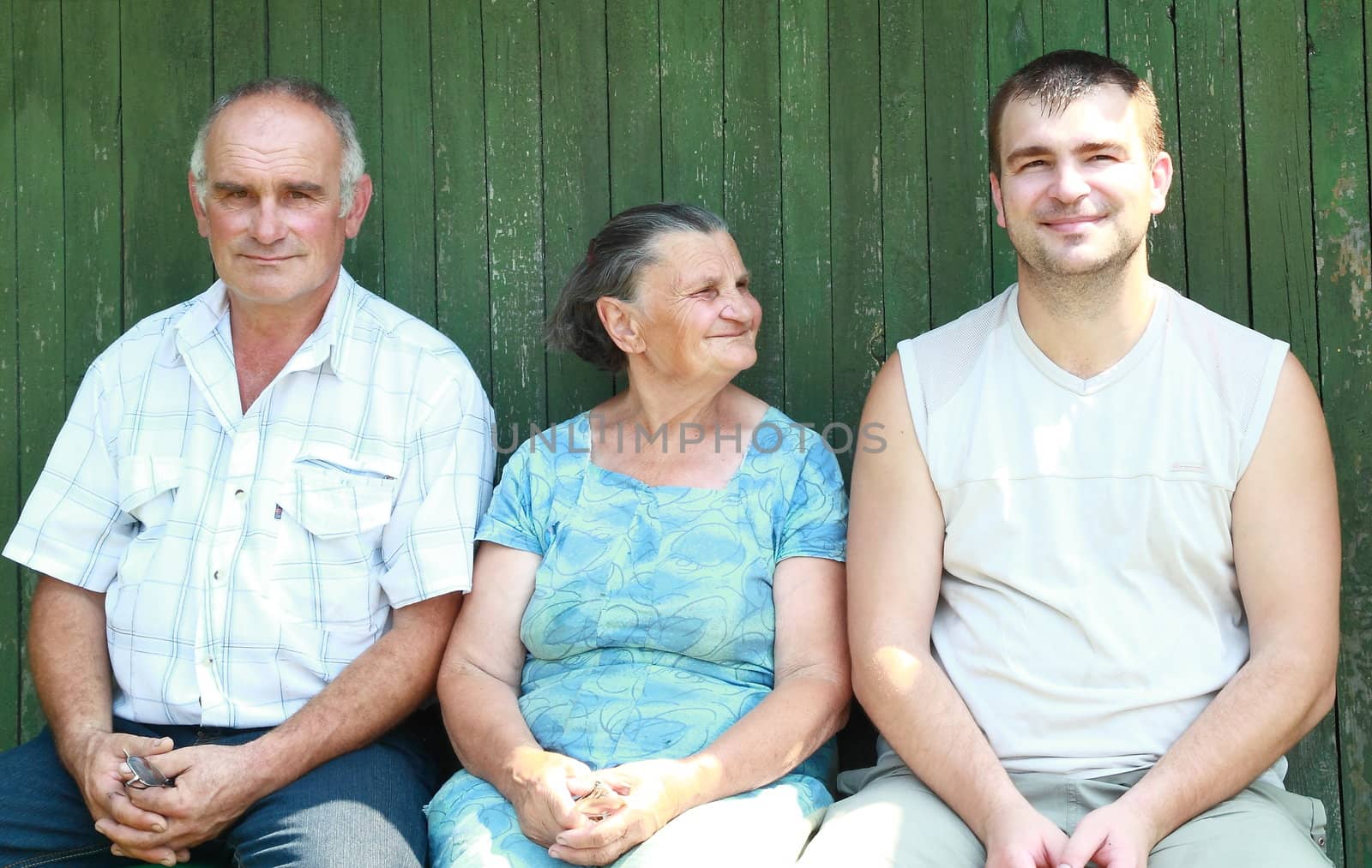The son and grandson came to visit her grandmother, and sat on a bench near the courtyard