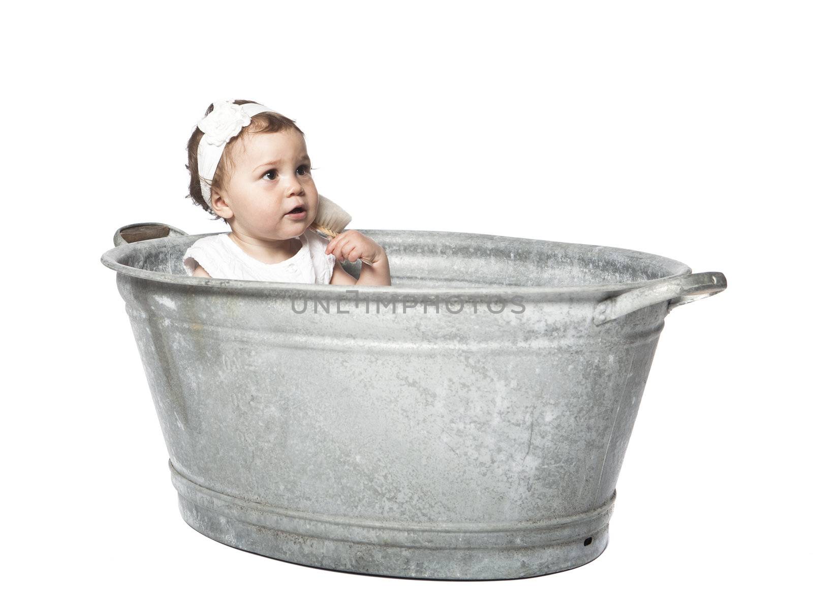 Baby in a bucket isolated on white