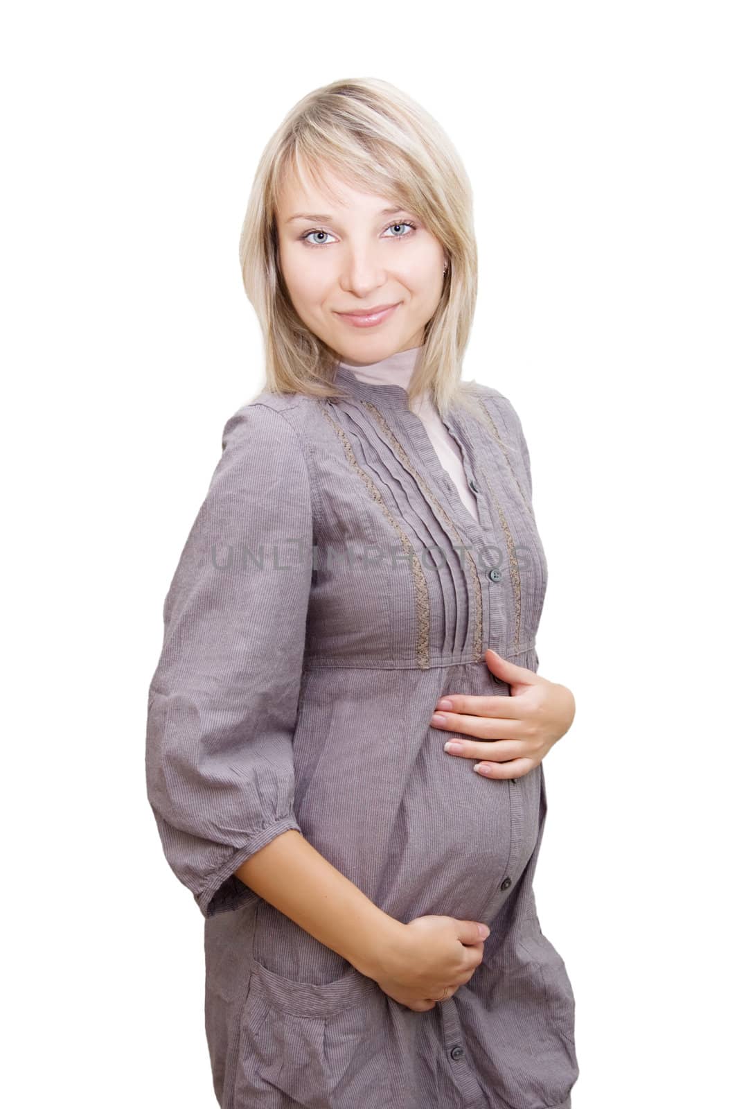 Smiling pregnant woman in gray dress over white background