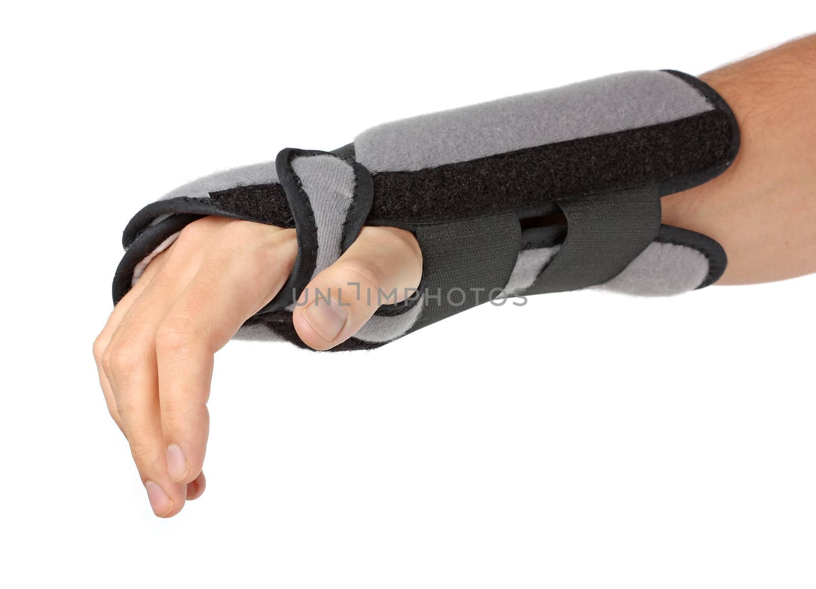Human hand with a wrist brace, orthopeadic equipment over white