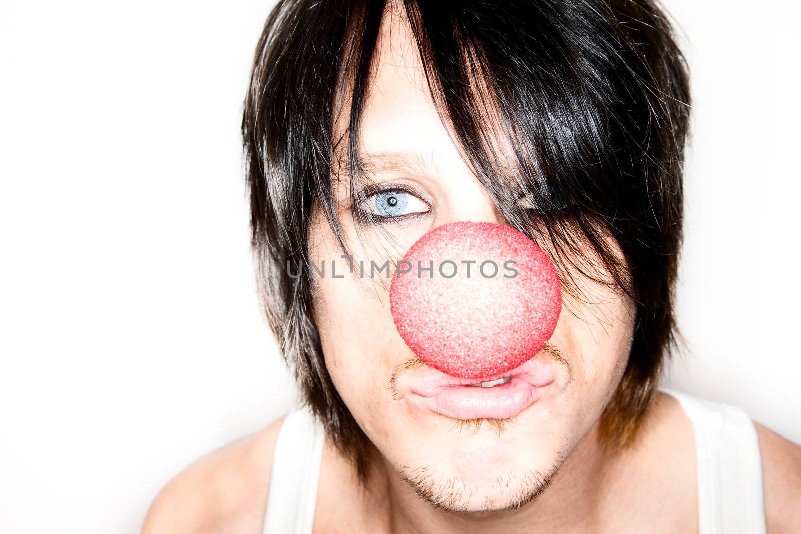 Handsome young male model with clown nose