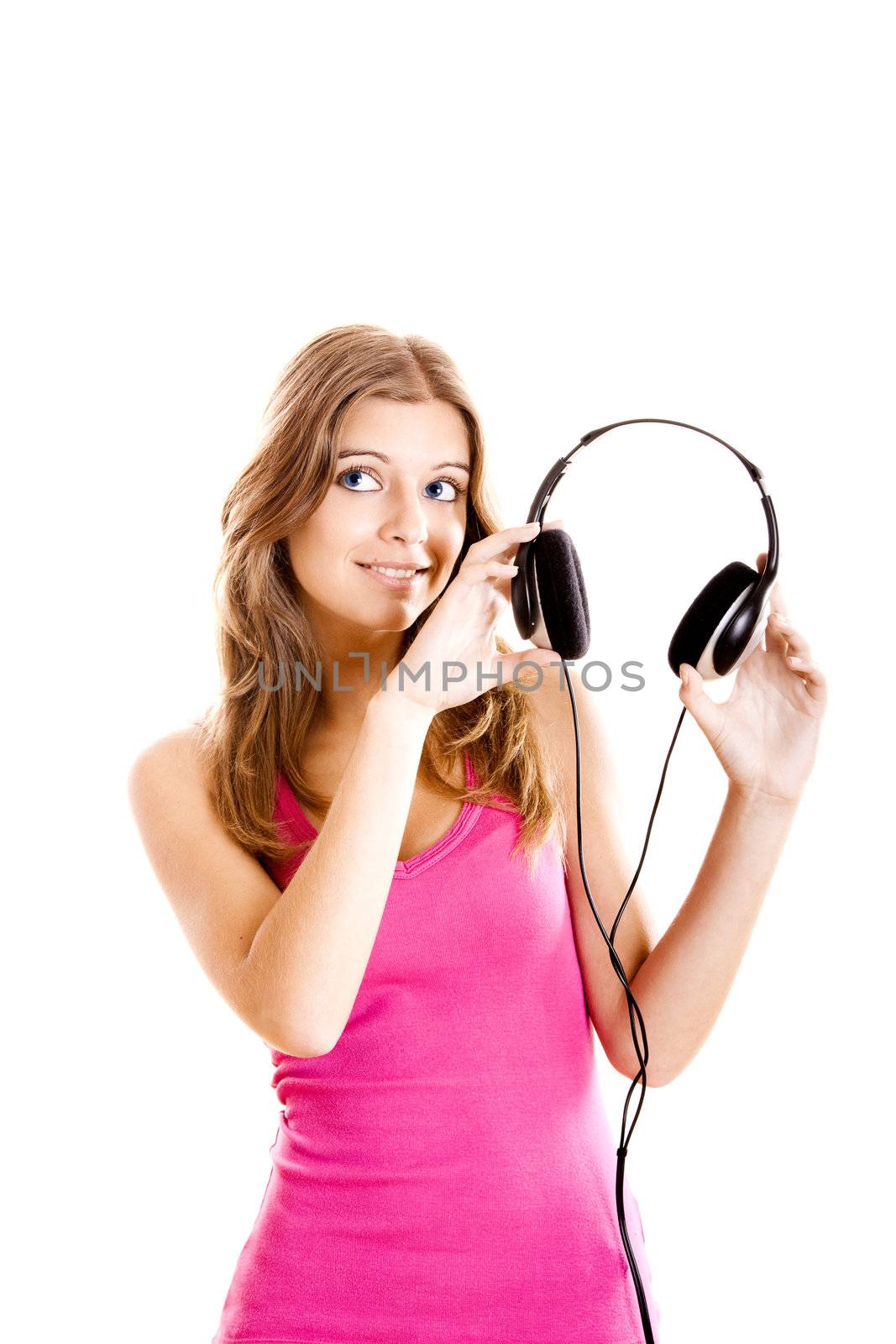 Beautiful young woman holding headphones isolated on white