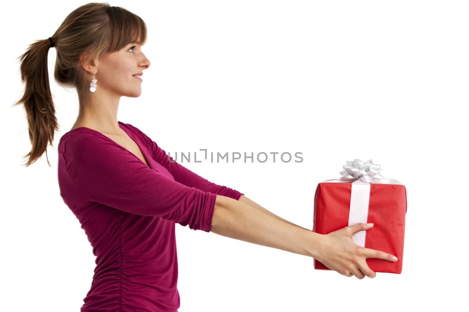 pretty young woman holding a present isolated on white