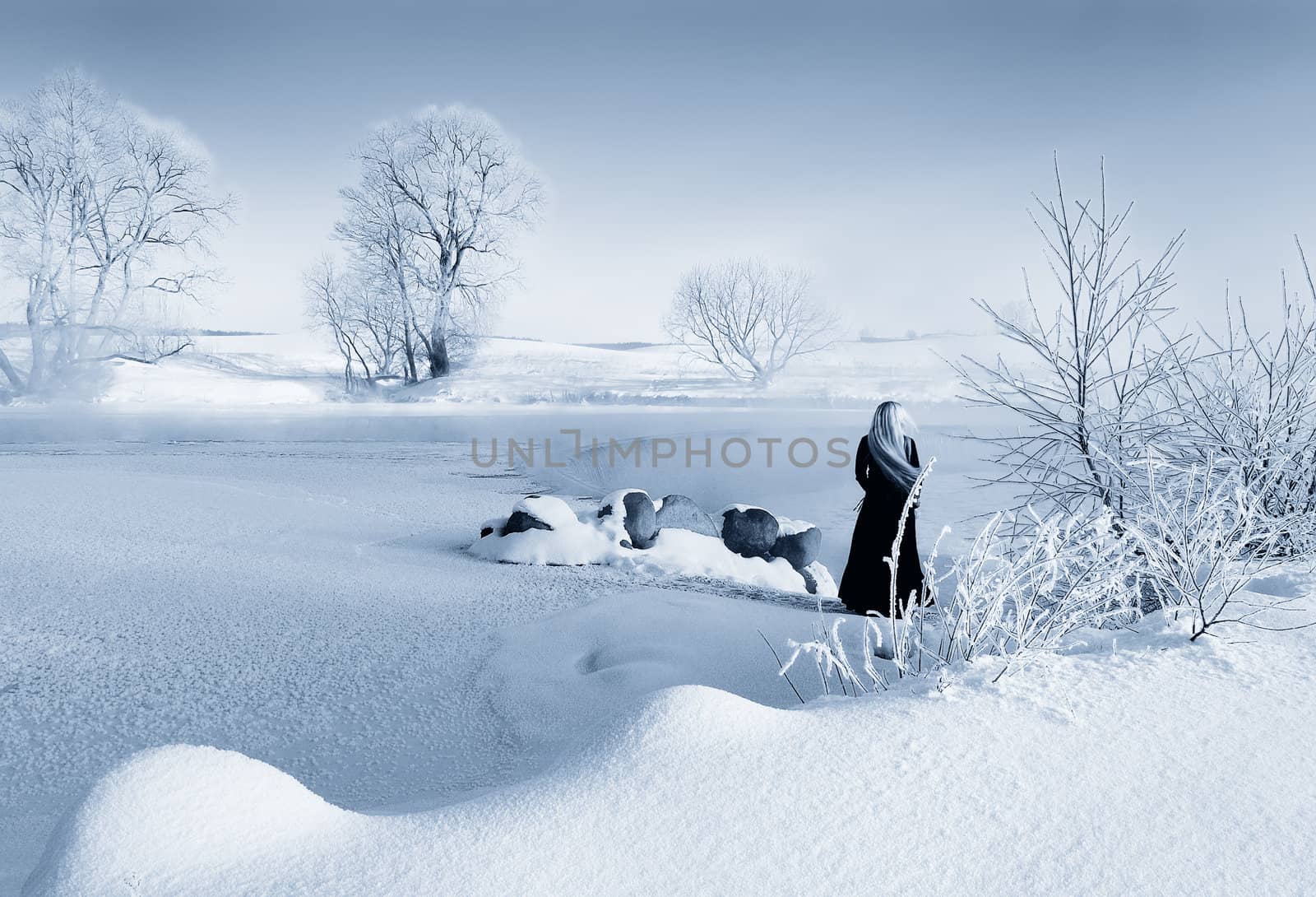Frosty winter morning in Belarus, the girl about the frozen reservoir.