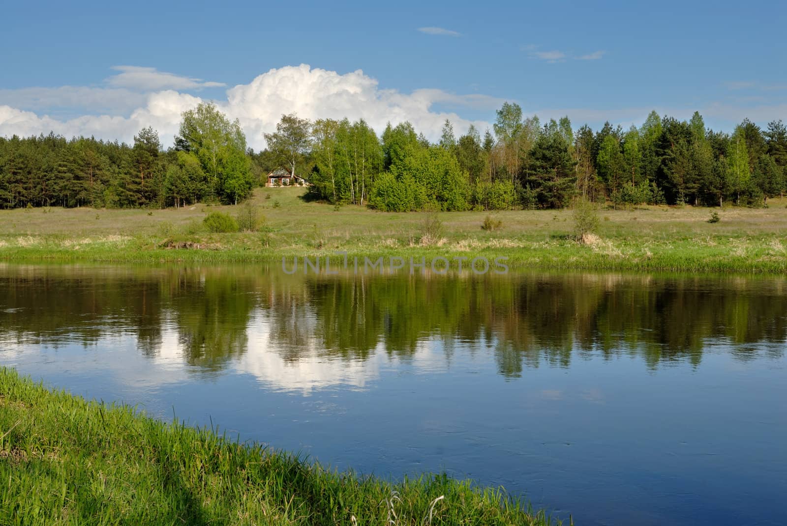 Cloud in the sky over the river Vilija in the spring afternoon.