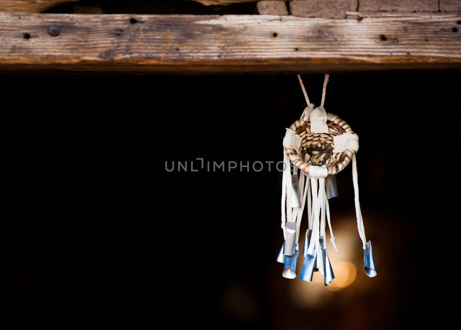 Native American Dream Catcher Suspended from Wooden Beam