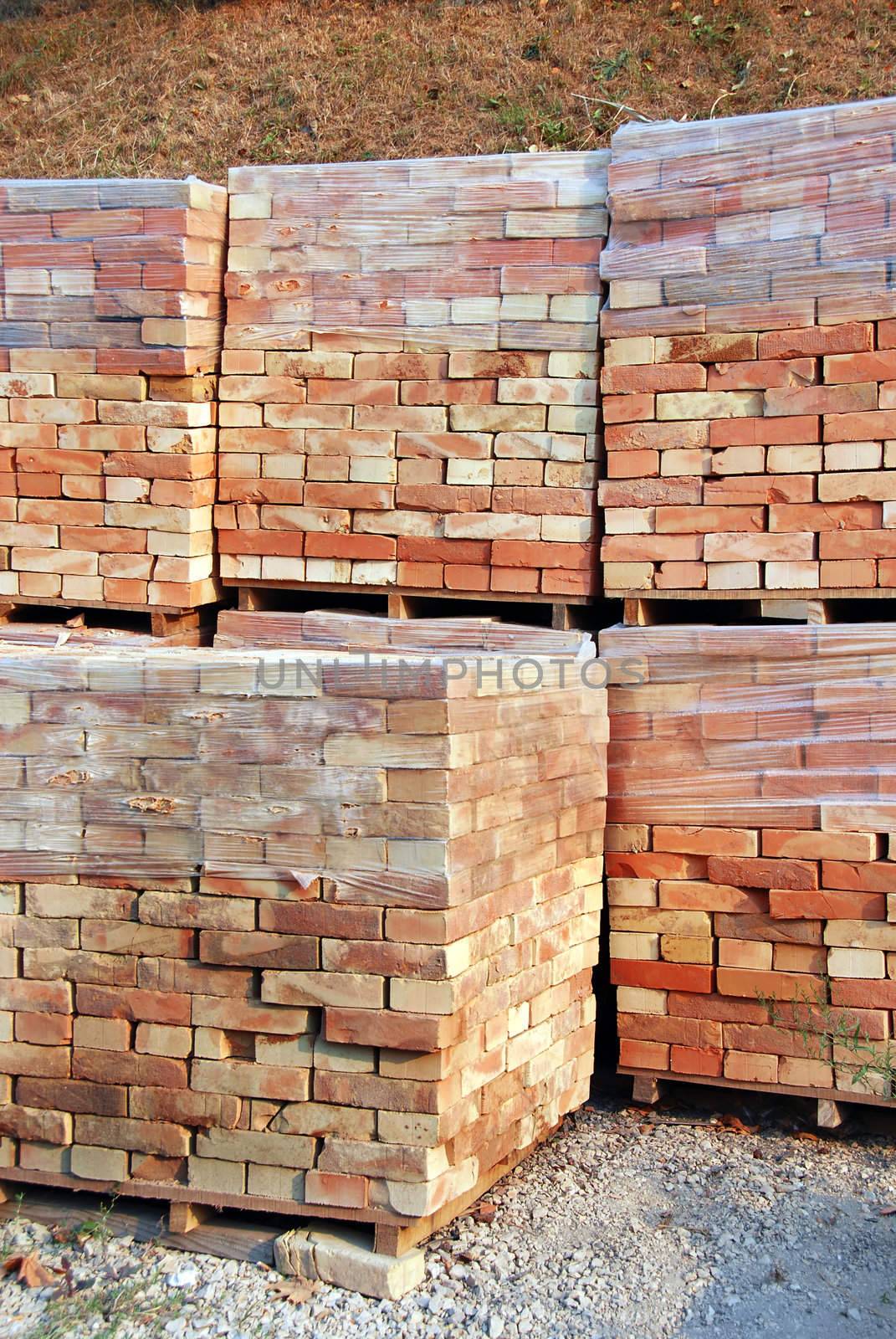 stacks of packed bricks outdoor, building material