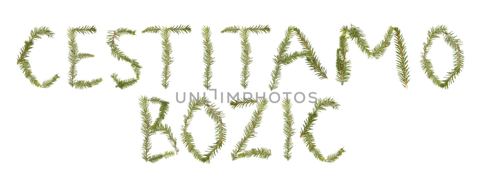Spruce twigs forming the phrase 'Cestitamo Bozic' isolated on white