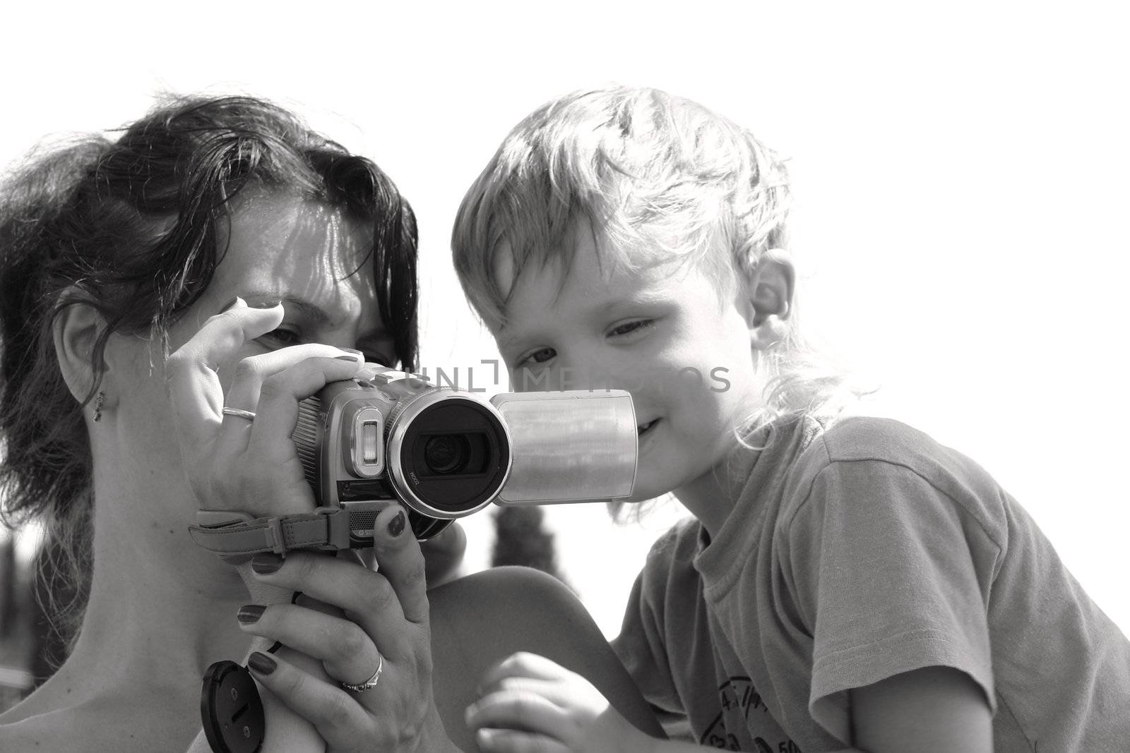 mother and son look skim the material                               