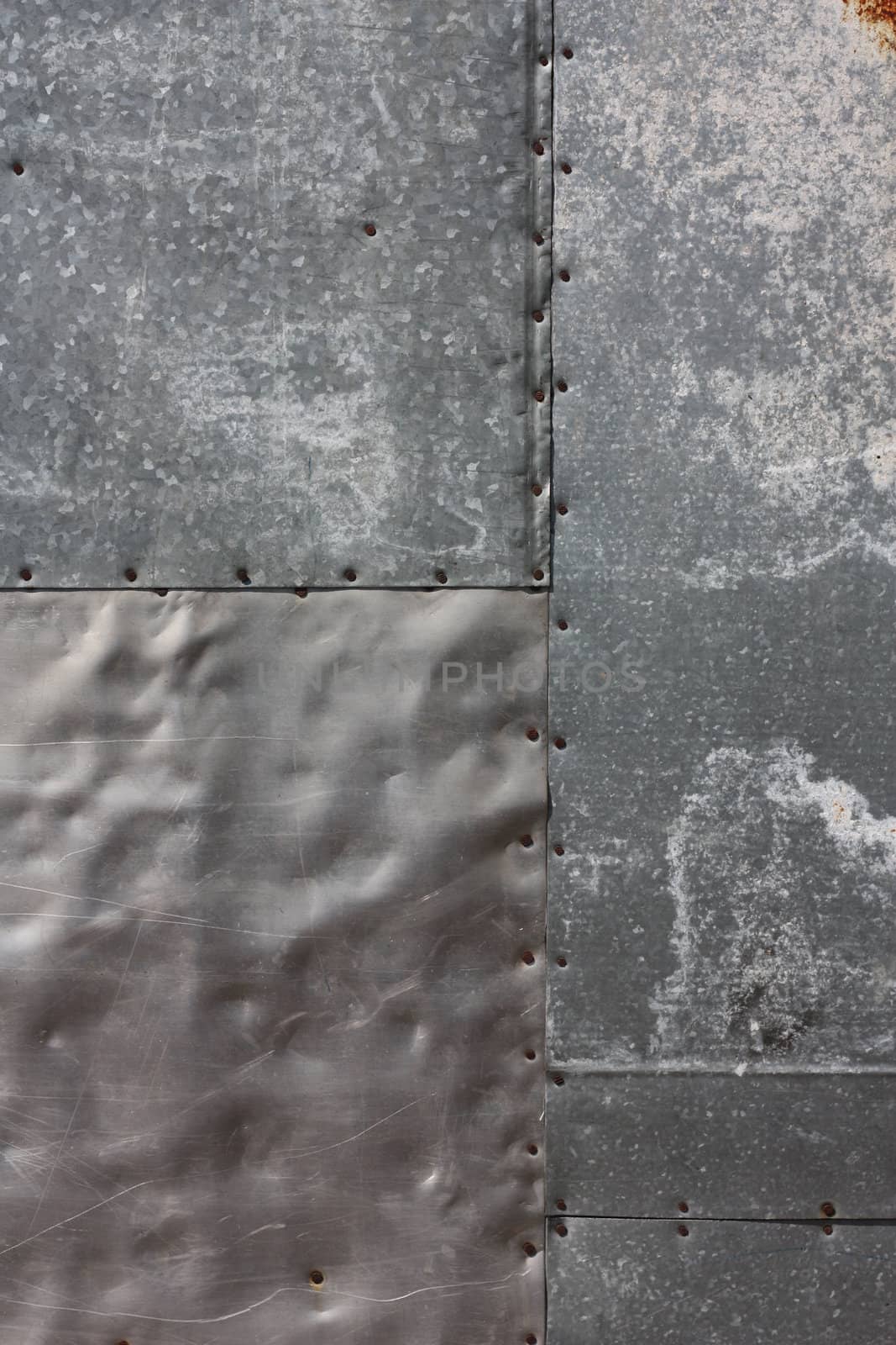 Wall of aluminum and tin punched with nails and covered with oxide