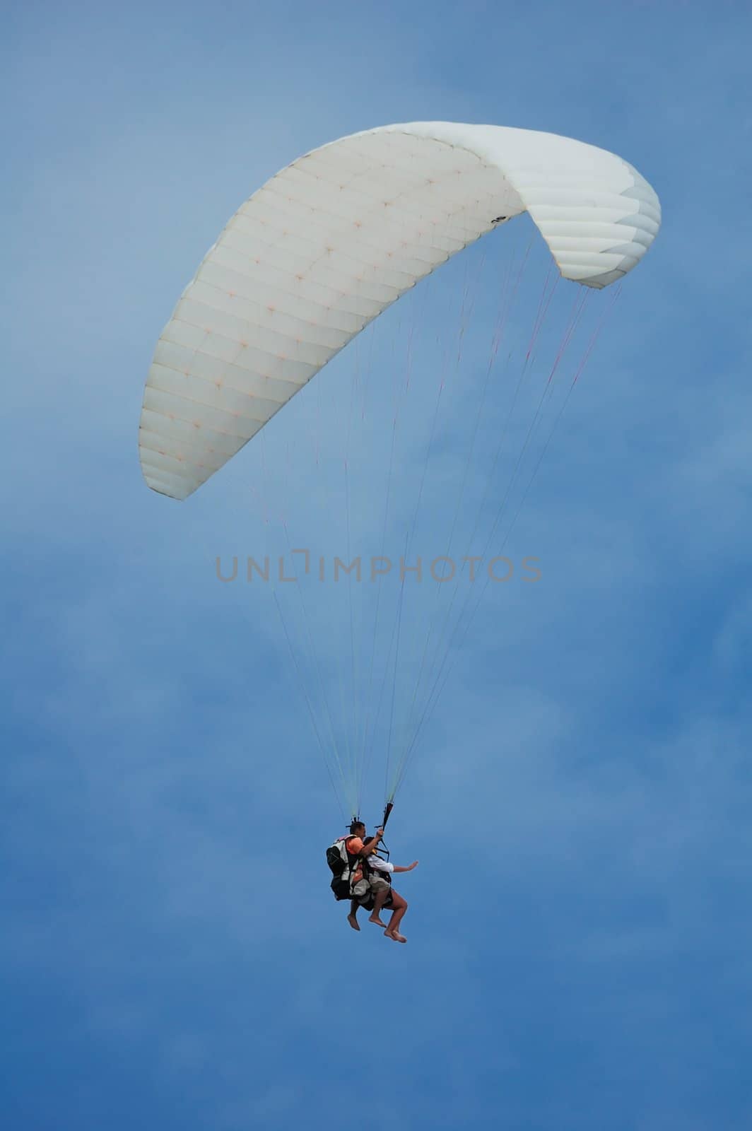 flights on a parachute by a clear summer day