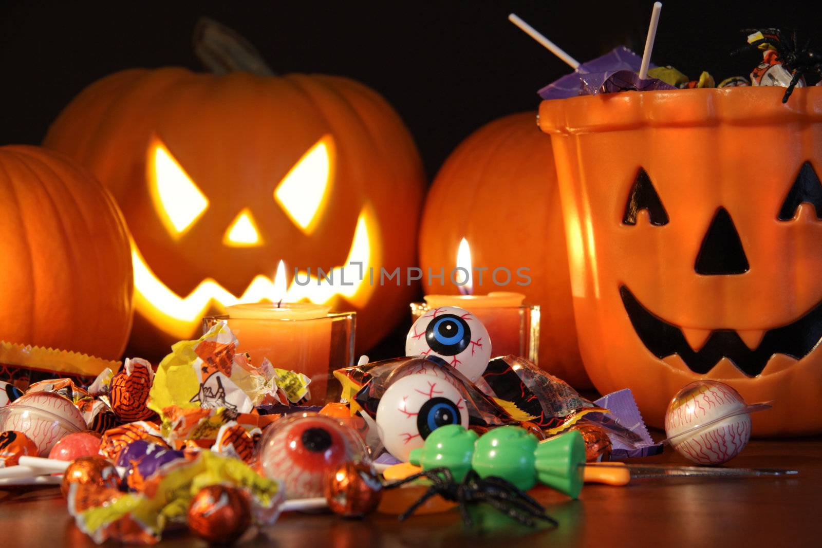 Closeup of candies with pumpkins  by Sandralise