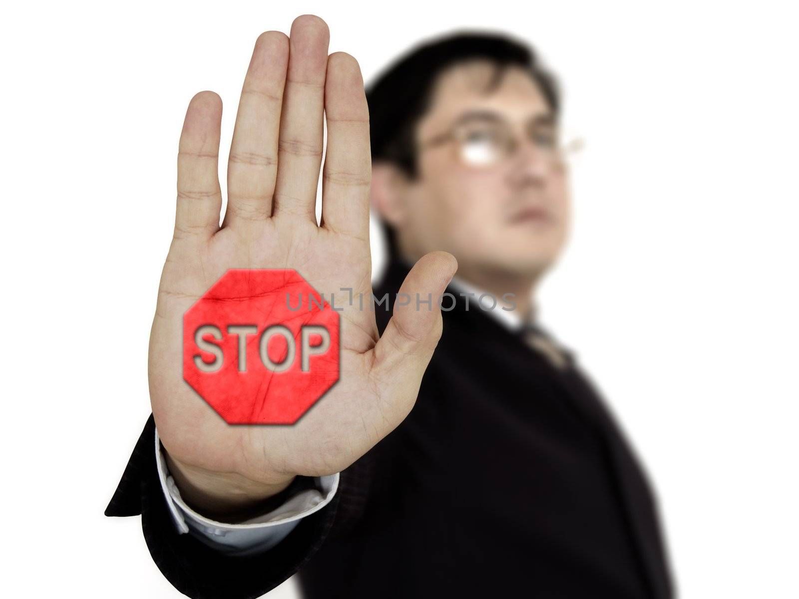 Businessman raising his hand and showing stop