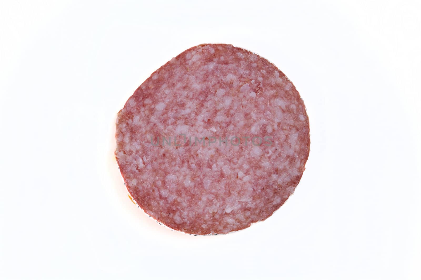 Macro picture of slice of salami isolated on white background