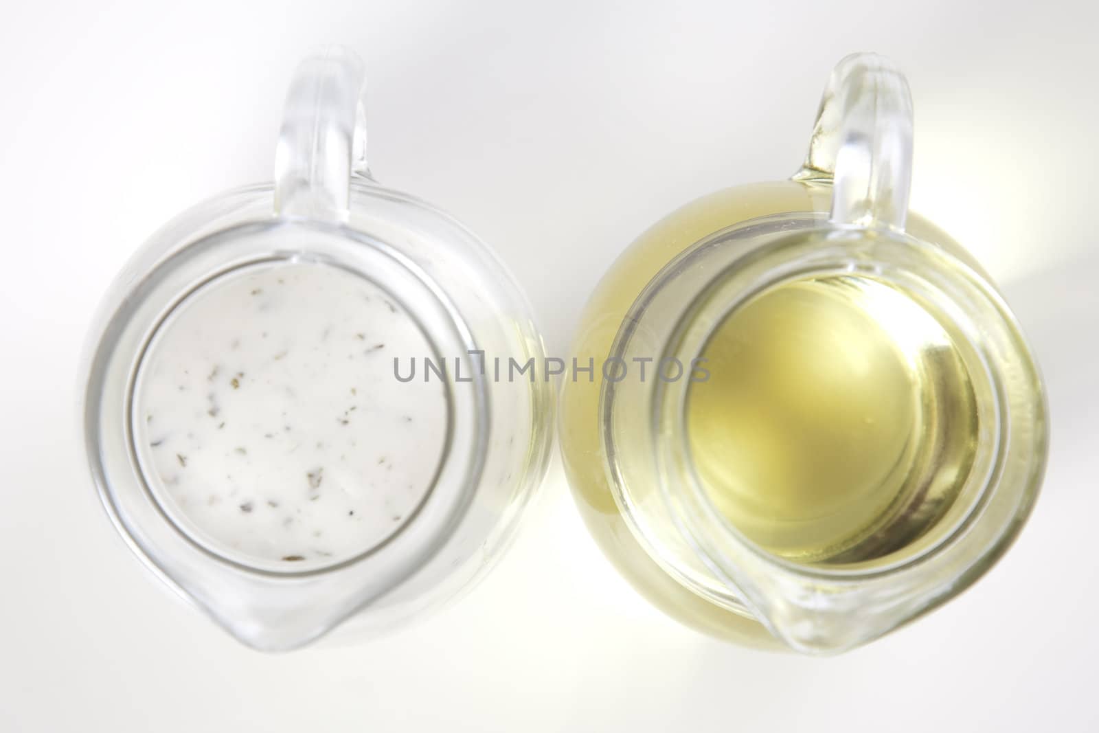 Small sause in glass on white background