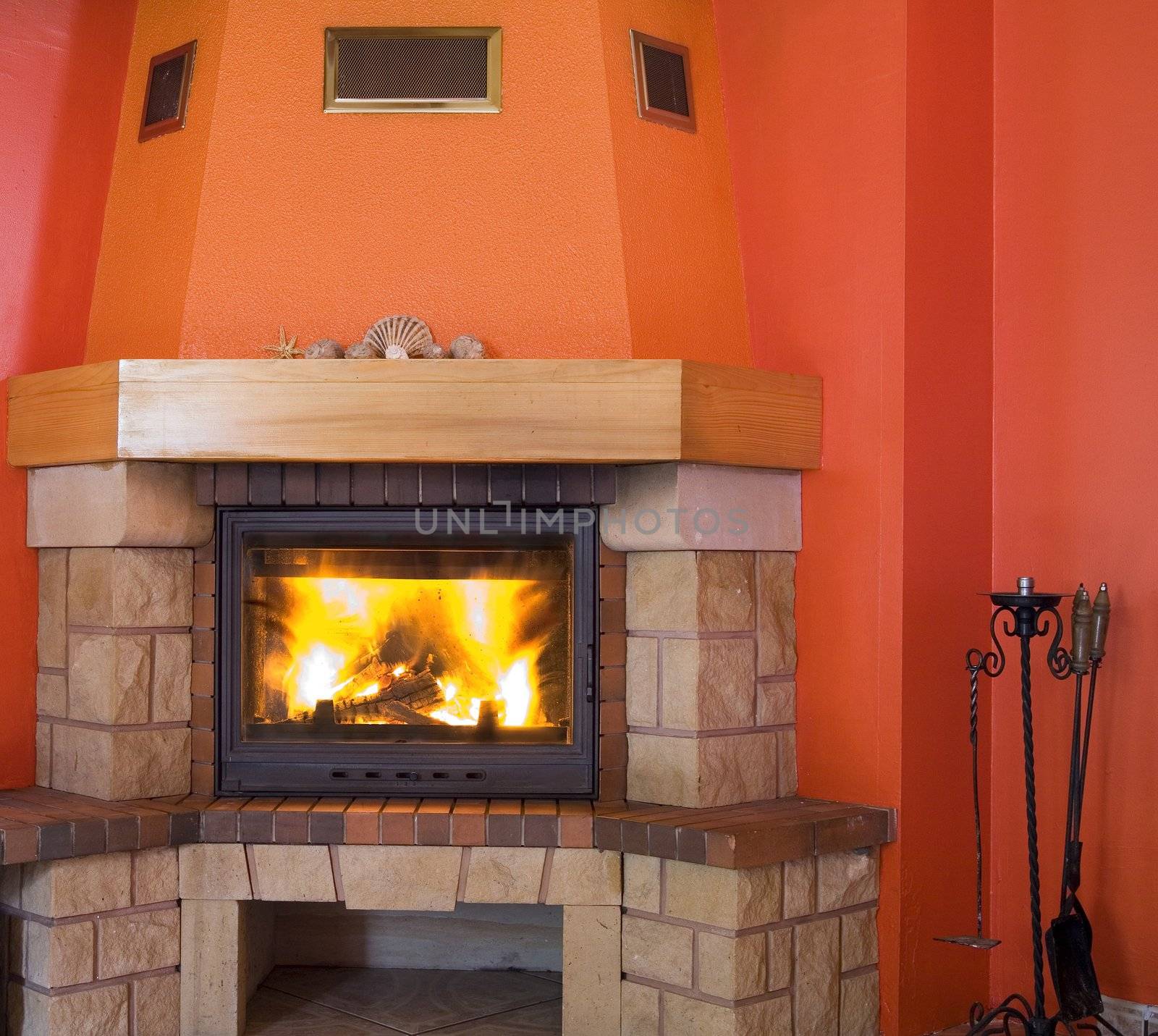 red fireplace with a small hell inside