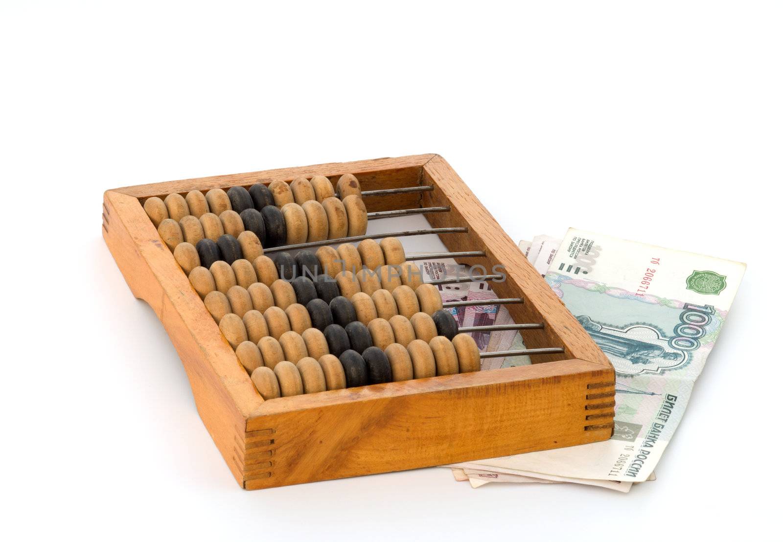 Wooden abacus and roubles on a white background.