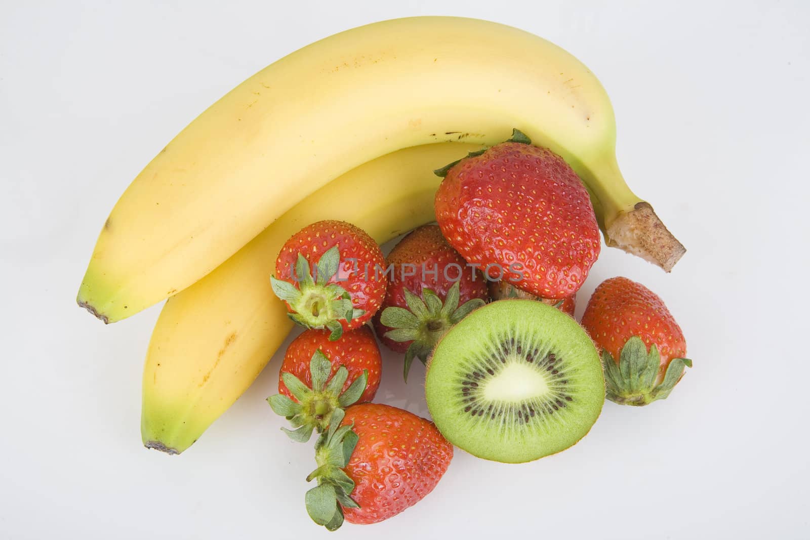 delicious fresh fruits: banana, strawberries and kiwi